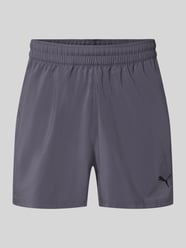 Szorty sportowe o kroju regular fit z nadrukiem z logo model „TAD ESSENTIALS” od PUMA Performance - 1
