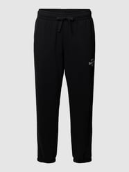 Spodnie dresowe z detalem z logo model ‘Essentials’ od New Balance Czarny - 44