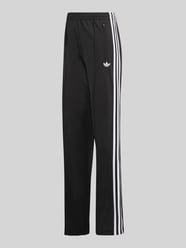 Spodnie dresowe o kroju loose fit z paskami w kontrastowym kolorze od adidas Originals - 2