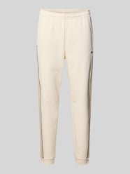 Spodnie dresowe z czystej bawełny w kroju regular fit od Lacoste - 27