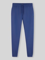 Spodnie dresowe o kroju slim fit z mieszanki bawełny od Tommy Jeans - 18