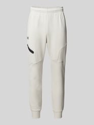 Relaxed Fit Sweatpants mit Logo-Print Modell 'Unstoppable' von Under Armour Beige - 29