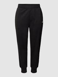 PLUS SIZE Sweatpants mit Label-Detail von PUMA Performance Plus Schwarz - 25