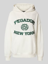 Oversized hoodie met logostitching, model 'Frieda' van Pegador - 27
