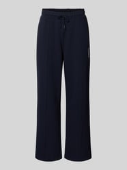 Spodnie dresowe w kroju loose fit z mieszanka bawełny model 'Tenn' od Lacoste - 23