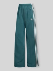 Spodnie dresowe o kroju loose fit z paskami w kontrastowym kolorze od adidas Originals - 3