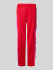 Spodnie sportowe o kroju regular fit z zakładkami w pasie model ‘BREAK’ od adidas Originals - 34