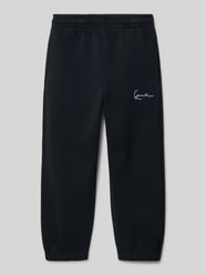 Spodnie dresowe o kroju regular fit z wyhaftowanym logo od KARL KANI - 9