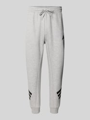 Slim fit sweatbroek met logoprint van adidas Sportswear - 32