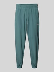 Form Pants mit Logo-Print und Eingriffatschen von Nike Training - 7
