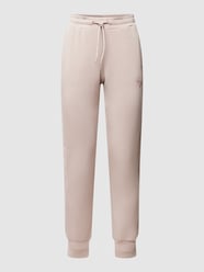 Spodnie dresowe z nadrukiem z logo model ‘ALLIE SCUBA’ od Guess Activewear Beżowy - 33