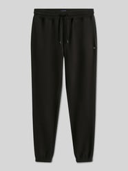 Spodnie dresowe o kroju slim fit z mieszanki bawełny od Tommy Jeans - 16