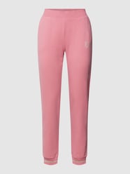 Spodnie dresowe z nadrukiem z logo model ‘PANTALONI’ od EA7 Emporio Armani Różowy - 28