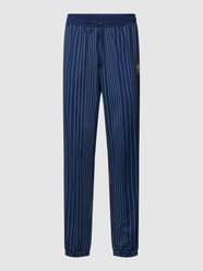 Sweatpants mit Streifenmuster Modell 'TAARSTEDT STRIPED' von FILA Blau - 47