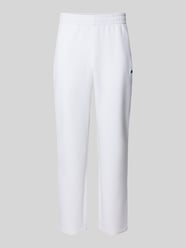 Spodnie dresowe o kroju tapered z dodatkiem bawełny od Lacoste Sport - 24