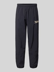 Spodnie treningowe z logo i elastycznym pasem od Nike - 30
