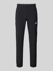 Slim fit trainingsbroek met logoprint, model 'Tech' van adidas Training - 13