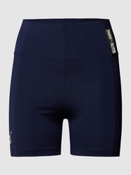 Korte broek met labeldetails van PUMA PERFORMANCE Blauw / turquoise - 41