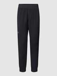 Spodnie dresowe z elastycznym ściągaczem od Under Armour Czarny - 46