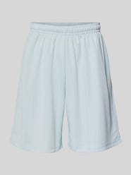 Szorty o kroju relaxed fit z elastycznym pasem model 'Insignia' od Karl Kani - 1