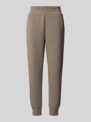 Spodnie dresowe o kroju slim fit z dodatkiem wiskozy model 'Victoire' od GUESS - 26
