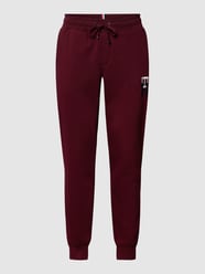 Spodnie dresowe z wyhaftowanym logo model ‘ESSENTIAL MONOGRAM’ od Tommy Hilfiger Czerwony - 38