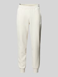 Relaxed Fit Sweatpants mit Label-Print von PUMA PERFORMANCE Beige - 1