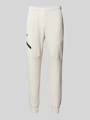 Spodnie dresowe z elastycznym ściągaczem od Under Armour - 17
