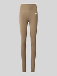 Eng anliegende Sport-Leggings mit Logo-Print von adidas Training Beige - 32